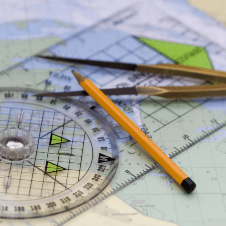 navigational chart with plotter, dividers and pencil